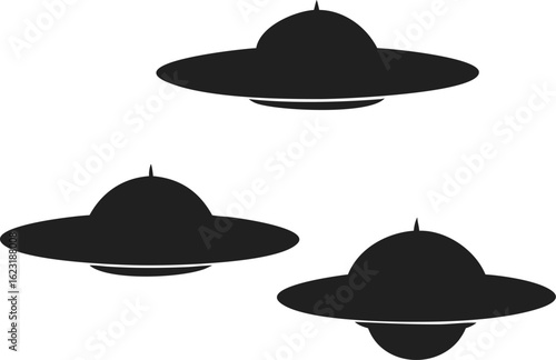 Three Simple Black Silhouettes of Flying Saucers on White