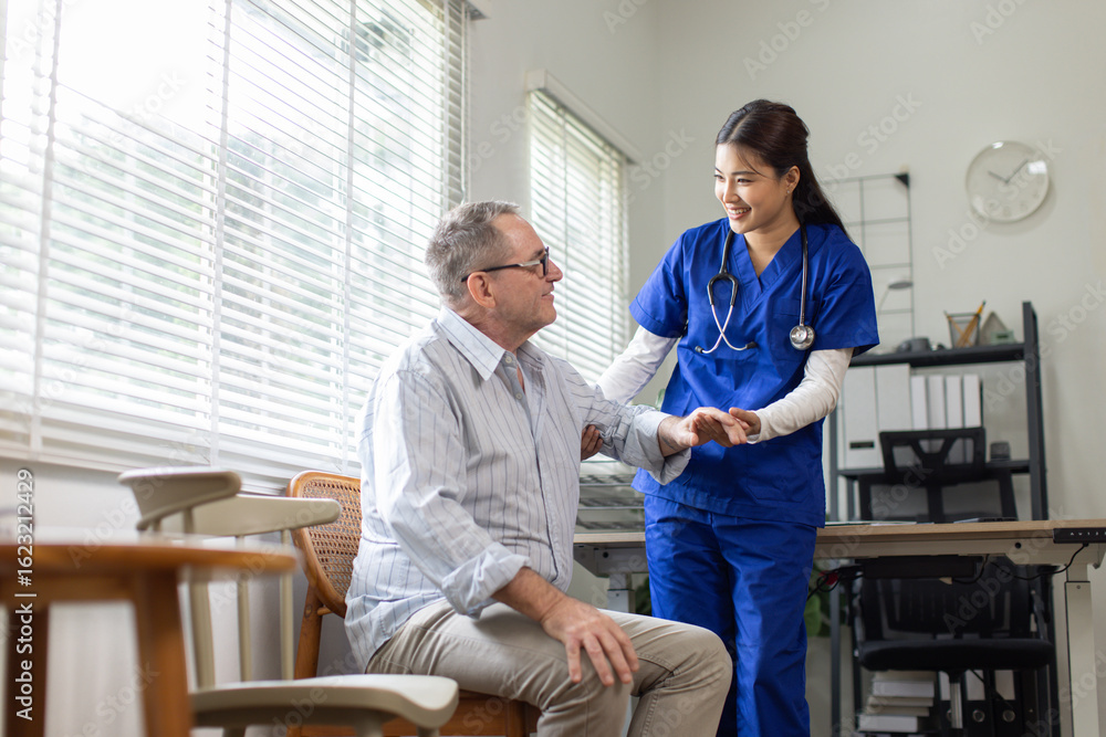 Fototapeta premium Young caregiver helping doctor or Nurse woman to walk at home 