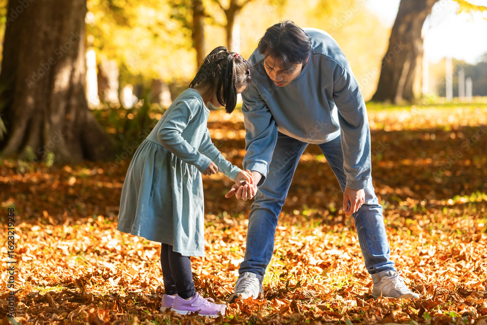 Father and daughter bonding during an autumn walk Father and daughter bonding during an autumn walk