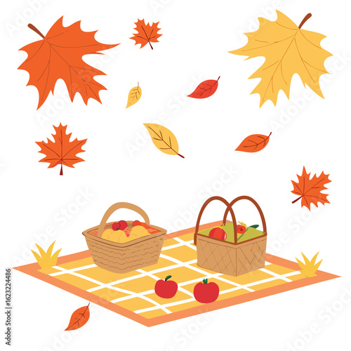Autumn picnic with apples and fallen leaves basket