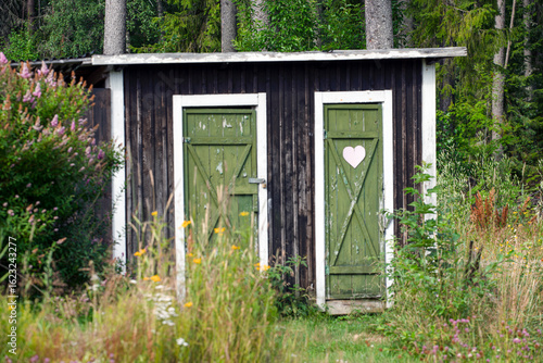 old wooden door with heart on toilett, jämtland,åre, norrland,hensjön,sverige,sweden,summer