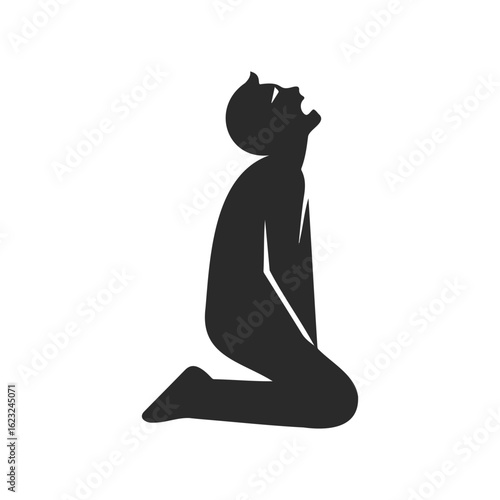 Silhouette of kneeling person in prayer with raised arms