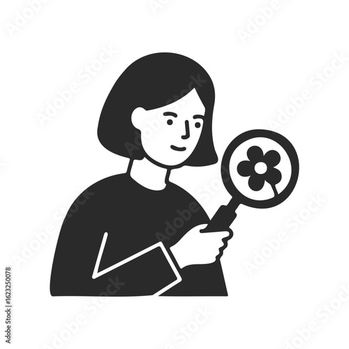 Young female exploring flower with magnifying glass