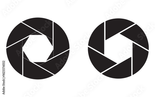 Black aperture blades forming circular openings camera lens