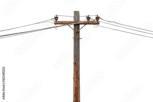 Close-up of weathered wooden utility pole with electrical wires