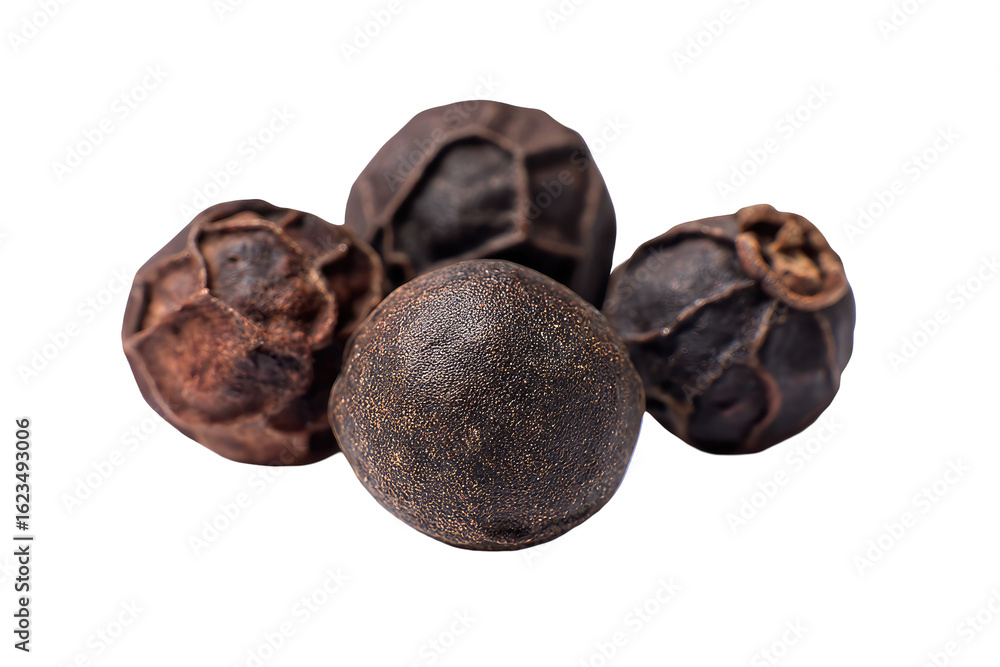 Close-up of four whole black peppercorns. Dark, textured spheres clustered together against a pure black background. Focus on the peppercorns' surface detail Close-up of four whole black peppercorns. Dark, textured spheres clustered together against a pure black background. Focus on the peppercorns' surface detail