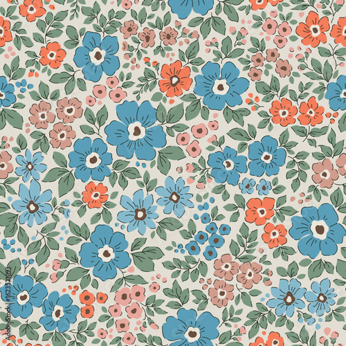Vintage seamless floral pattern. Liberty style background of small blue and orange flowers. Small flowers scattered over a beige background. Stock vector printing for surfaces. Abstract flowers. 
