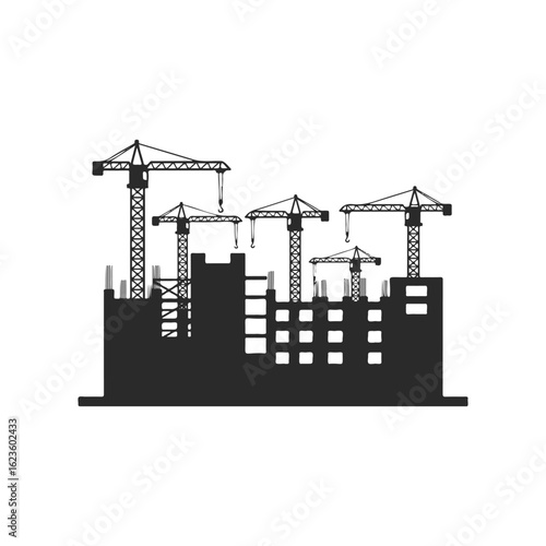 Silhouette of construction site with tower cranes and building framework