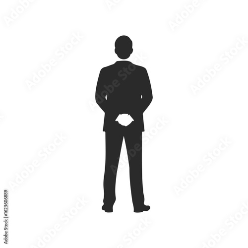 Silhouette of young adult male in formal suit from behind