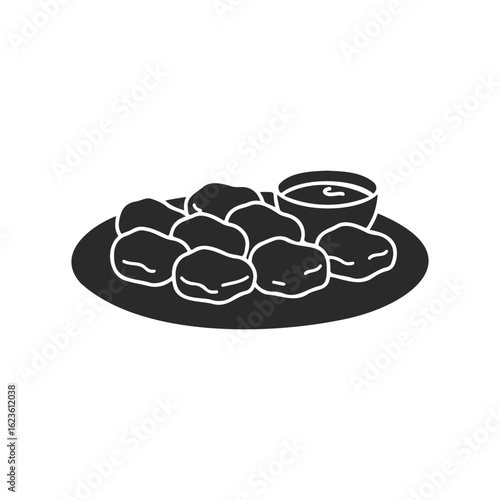 Silhouette of chicken nuggets with dipping sauce on plate
