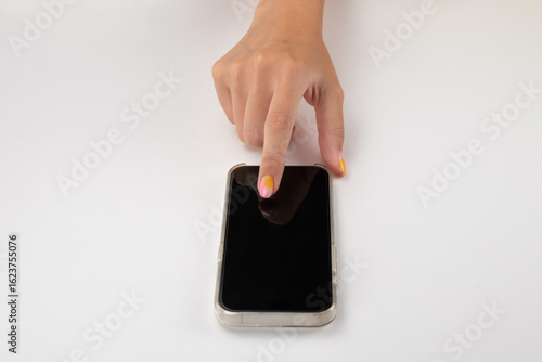 Caucasian woman's hand touching a smartphone screen (mockup), isolated on white background
