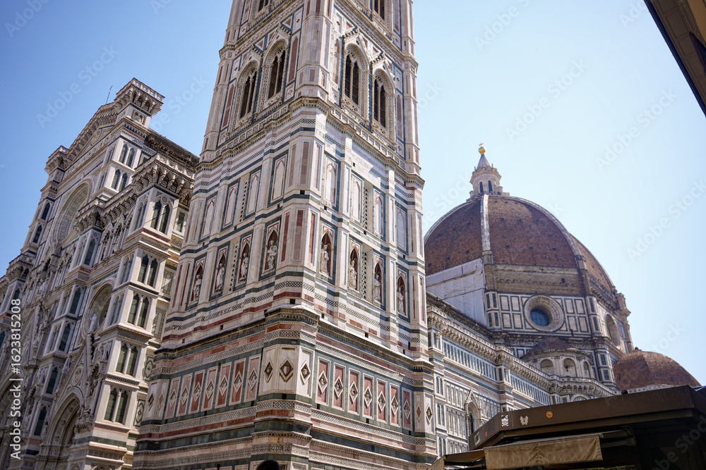 Fototapeta premium Close up of Florence Cathedral with Giotto bell tower and Brunelleschi dome on sunny day Italy