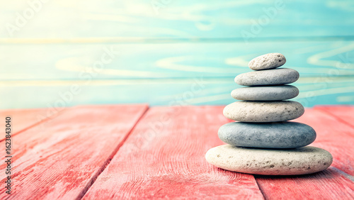 Stack of pebbles stone balance on wooden table, harmony and meditation