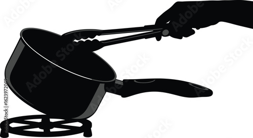 Vector art of a black silhouette illustration of a hand using tongs to hold a cooking pot on a trivet, representing food preparation