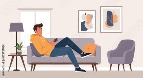 Man Relaxes On Sofa While Using Mobile Phone At Home In Modern Interior