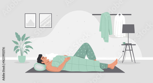 Man Relaxing Under Quilt On Mat Indoors In Calm Bedroom Environment