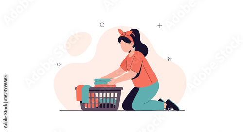 Woman Folding Clean Laundry At Home In A Modern Minimalist Style
