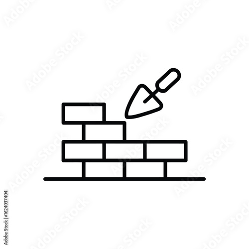 Trowel and brick wall construction icon