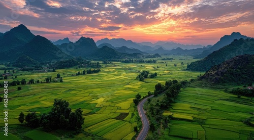 Wallpaper Mural Panoramic sunset view of verdant rice paddies nestled in a valley between karst mountains Torontodigital.ca