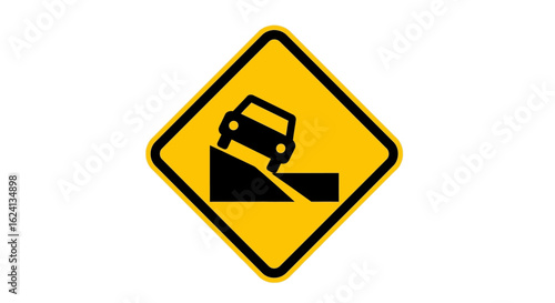 Yellow diamond traffic warning sign indicating a steep embankment or drop-off ahead on the road. Safety first concept.