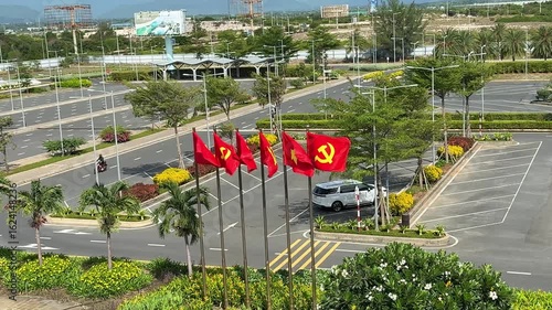 Vietnam, Nha Trang - 05.07.2025 - Red flag of Vietnam, yellow star on a red background. Socialism, sickle and hammer on the flag, USSR banner, ideology communism, Cam Ranh airport