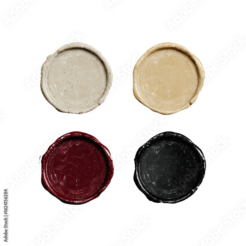 Four round, textured wax seals in varying colors