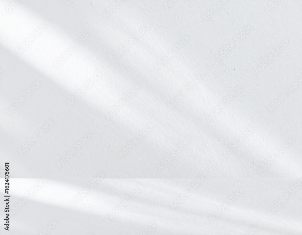 Obraz premium Clean White Wall Background with Dappled Sunlight