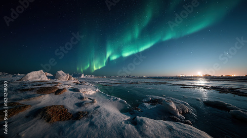 Mesmerizing northern lights over icy landscape with snow and frozen sea, ideal for arctic nature and aurora photography