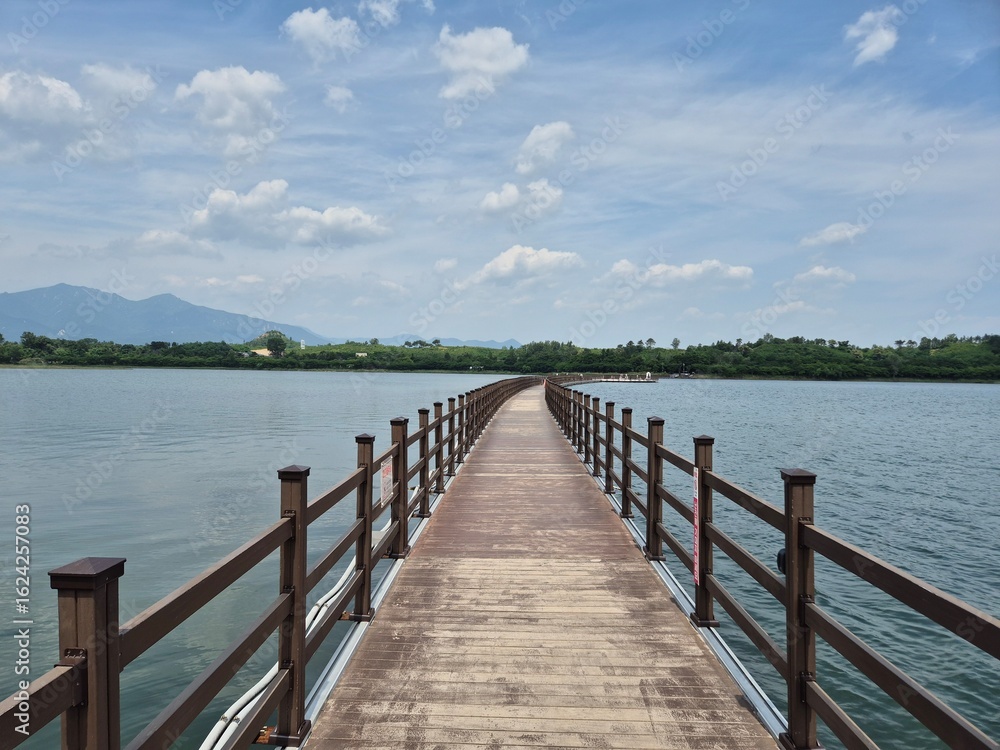 Naklejka premium wooden bridge over the lake