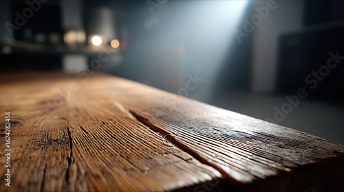 Cracked rustic wooden table illuminated by intense god rays in bright setting