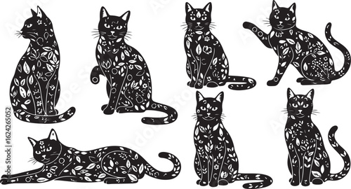 Set of seven black silhouette cats adorned with white floral patterns and leaves vector