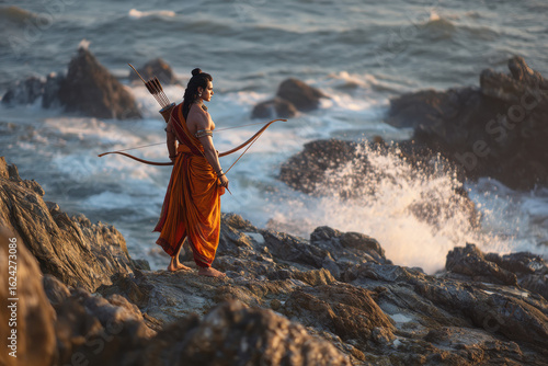 Lord Rama standing on the rocks with a bow and arrow in his hand.