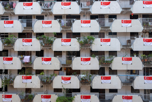 Photography Singapore flags hang on the HDB housing flat