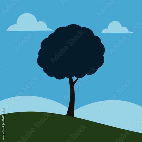 A solitary dark tree stands on a green hill under a blue sky with clouds
