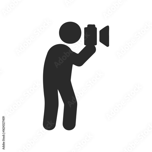 Silhouette of person taking a photograph with a camera