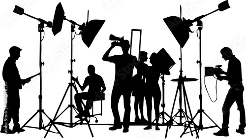 Silhouette of a film crew working on a set with lighting equipment and various crew members in action | editable eps vectors