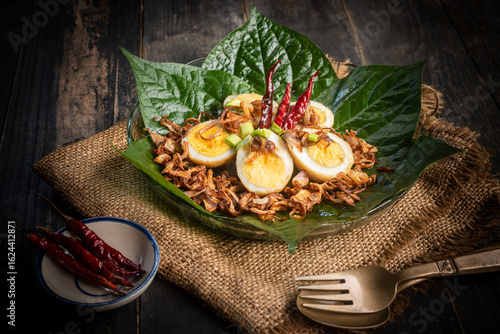 Fotografie Fried boiled egg with tamarind sauce (Son-in-law Eggs)