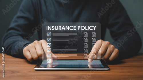 Person reviewing insurance policy details on digital tablet, confirming coverage and benefits with secure digital access