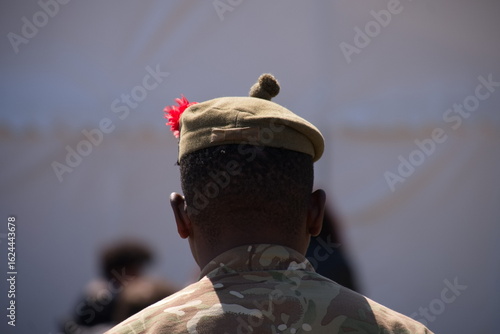 Solider wearing a beret from behind