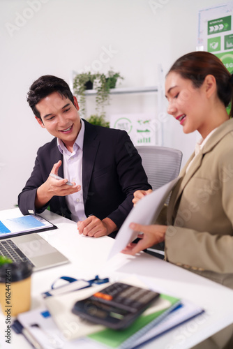 Wallpaper Mural Asian business professionals collaborate discuss market data strategic planning corporate meeting modern office productive work environment sustainability initiatives Torontodigital.ca