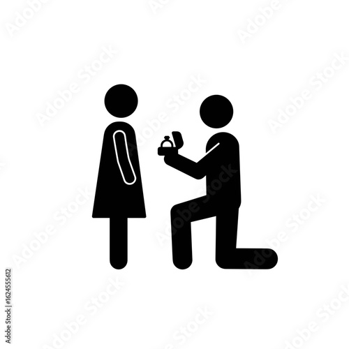 Man proposing marriage to woman while kneeling with ring box  
