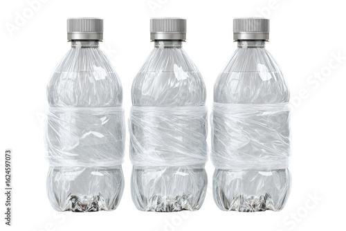 Three empty plastic water bottles wrapped in plastic film recycling waste
