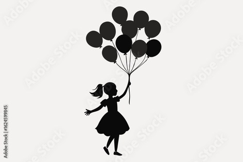 Silhouette of a happy girl in a dress holding a bunch of black balloons
