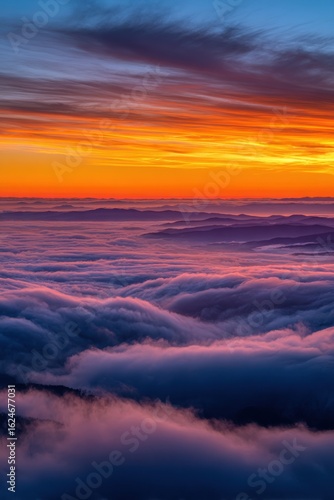 Breathtaking Sunrise Over a Sea of Clouds with Mountain Ridges in the Distance