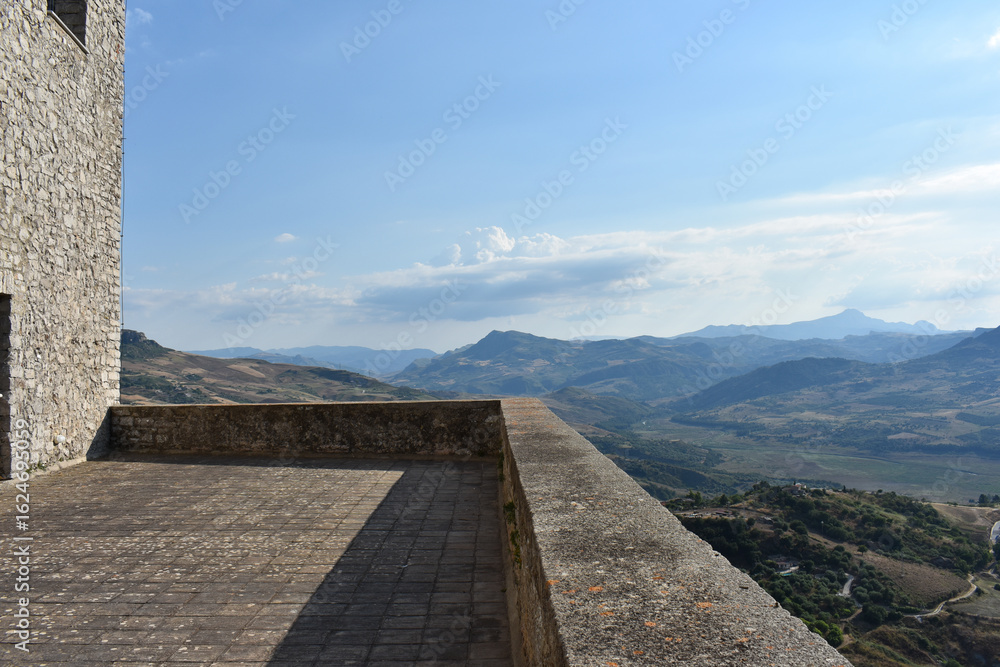 Fototapeta premium Castle of Caccamo, Sicily. Medieval castle near Palermo and surrounding countryside. Travel and tourism concept. Holidays in Sicily. Travel to Italy. Sightseeing. 