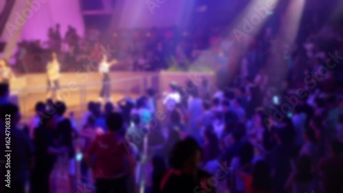 Wallpaper Mural Out of focus of Crowd people making party at a concert disco nightclub. People dancing at party in club full with light illumination onboard cruise ship.Happy people dance in nightclub party concert Torontodigital.ca