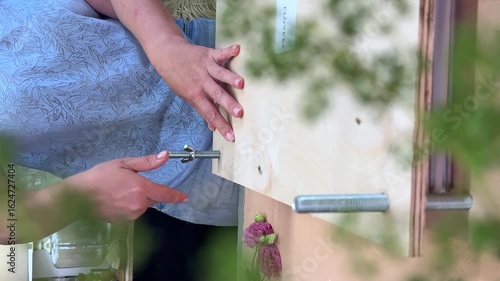 Wallpaper Mural Tightening bolts on a wooden flower press with herbarium inside. Essential step in flower pressing to preserve blooms for botanical art, herbarium projects, DIY crafts, and natural decoration Torontodigital.ca