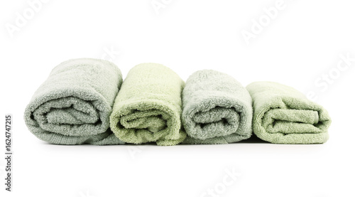 Rolled green towels isolated on white. Home textile