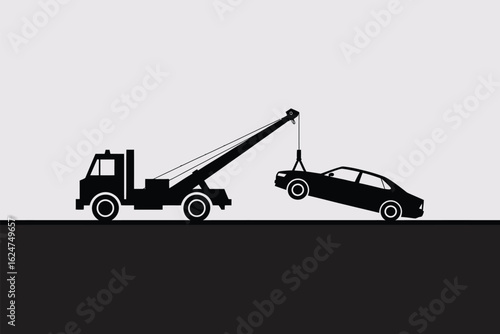Tow truck hauling a car silhouette