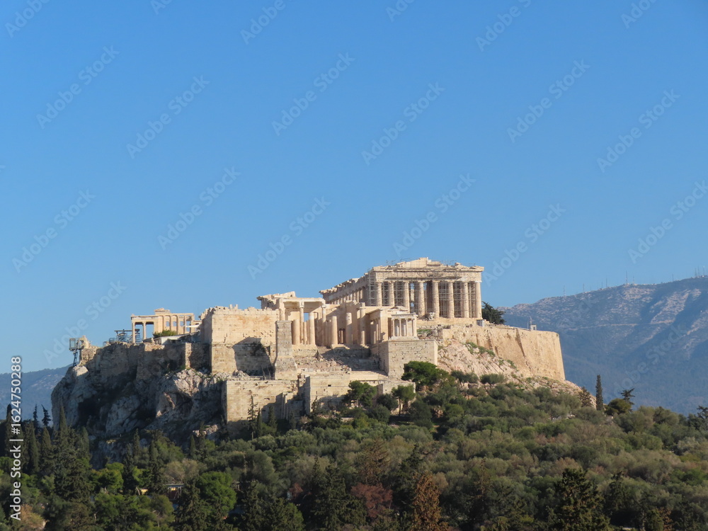 Fototapeta premium The Acropolis of Athens, an ancient citadel perched on a rocky hilltop, showcasing classical Greek architecture and historical grandeur.